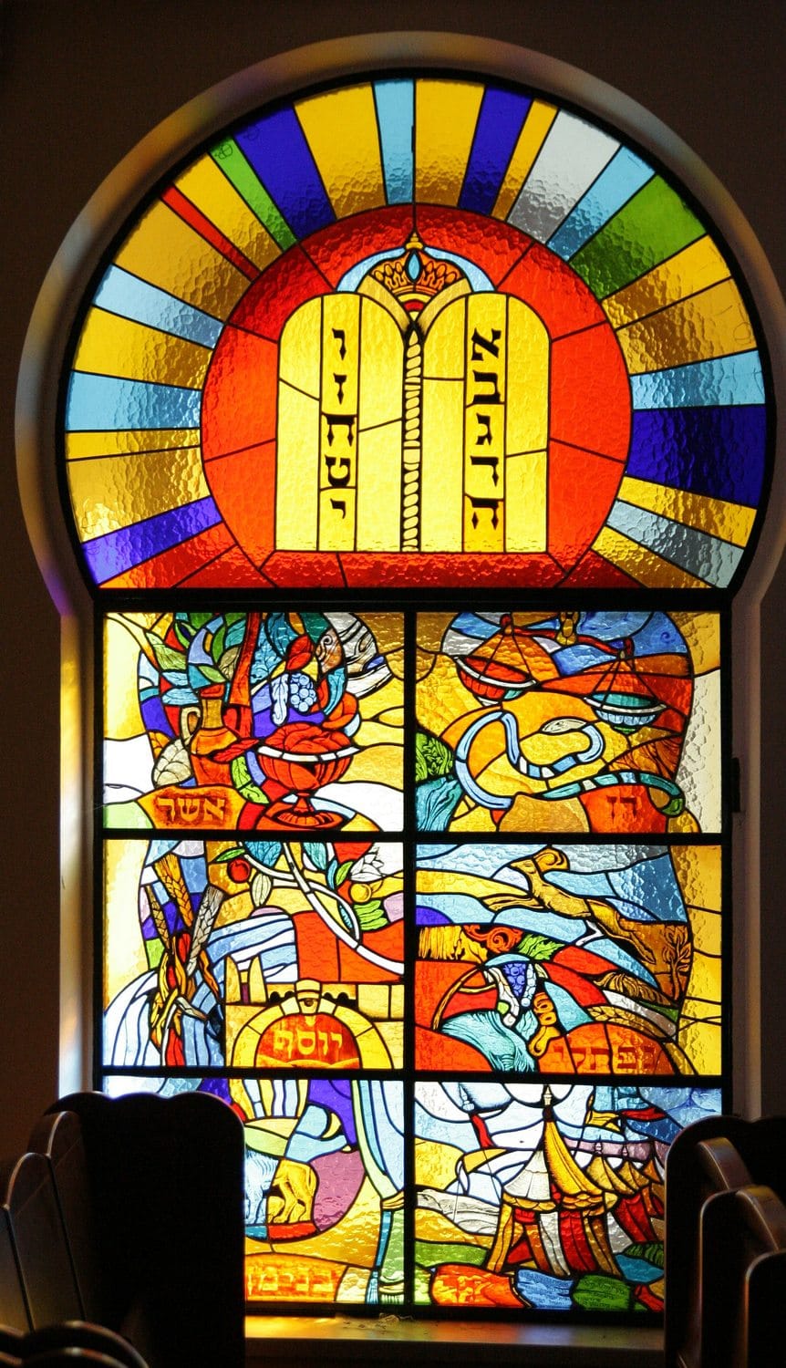 Stained glass window of the Tablets of the Law above the emblems of the Twelve Tribes
